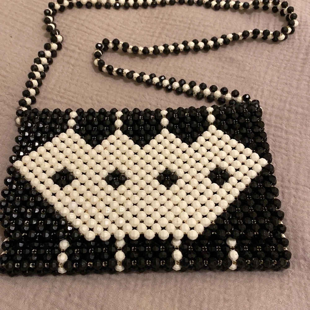 Black and white beaded shoulder beautiful bag .